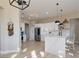 Modern kitchen featuring white cabinets, quartz countertops, stainless steel appliances, and ample lighting at , Las Vegas, NV 89134