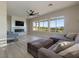 Living room with a linear fireplace, plush sectional seating, and picturesque views of the golf course and mountains at , Las Vegas, NV 89134