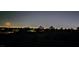 Expansive night view highlighting the city skyline illuminated under a dark, moonlit sky at , Las Vegas, NV 89134