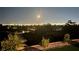 Night view of Las Vegas cityscape from the backyard, highlighted by artificial turf and desert landscaping at , Las Vegas, NV 89134