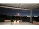 Inviting patio with a pergola, offering breathtaking night views of the city skyline at , Las Vegas, NV 89134