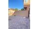 Private backyard featuring stylish stone patio and gravel landscaping at 10349 Mystic Pine Rd, Las Vegas, NV 89135