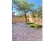 Backyard featuring stone pavers, gravel, and a small grass area, creating a lovely outdoor space at 10349 Mystic Pine Rd, Las Vegas, NV 89135