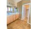 Bathroom with a double sink vanity, and a view to a walk-in closet provides convenience and ample storage at 10349 Mystic Pine Rd, Las Vegas, NV 89135