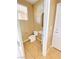 Well-lit bathroom with a pedestal sink, tile flooring, and white fixtures creates a clean and functional space at 10349 Mystic Pine Rd, Las Vegas, NV 89135