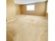 A bedroom with carpet flooring, two windows, and neutral walls offer a bright and inviting atmosphere at 10349 Mystic Pine Rd, Las Vegas, NV 89135