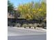 The Ladera community entrance features attractive landscaping and a decorative stone sign at 10349 Mystic Pine Rd, Las Vegas, NV 89135