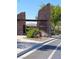 Stone entrance to The Mesa community with desert landscaping and well-maintained grounds at 10349 Mystic Pine Rd, Las Vegas, NV 89135