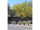 Welcoming entrance to Ladera featuring lush greenery, desert plants, and a stone sign at 10349 Mystic Pine Rd, Las Vegas, NV 89135