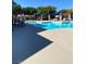 Community pool with nearby seating areas at 10349 Mystic Pine Rd, Las Vegas, NV 89135