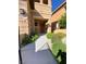 Inviting front entrance with desert landscaping, covered porch, and neutral color palette at 10349 Mystic Pine Rd, Las Vegas, NV 89135