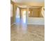 Bright living room with neutral walls, tile flooring, and an open floor plan at 10349 Mystic Pine Rd, Las Vegas, NV 89135
