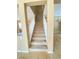Carpeted staircase with white railing, connecting two levels in a naturally lit space at 10349 Mystic Pine Rd, Las Vegas, NV 89135