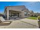Spacious backyard featuring a covered patio, well-manicured lawn and lush landscaping at 10456 Skye Arroyo Ave, Las Vegas, NV 89166