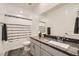 Bathroom with shower/tub combo and granite countertops is well lit and inviting at 10456 Skye Arroyo Ave, Las Vegas, NV 89166