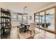 Dining area with modern light fixture, sliding glass doors, and comfortable seating at 10456 Skye Arroyo Ave, Las Vegas, NV 89166