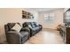 Comfortable living room featuring modern furniture, hardwood floors, and tasteful decor at 10456 Skye Arroyo Ave, Las Vegas, NV 89166