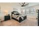 Spacious main bedroom features neutral tones, large windows, and a decorative ceiling fan at 10456 Skye Arroyo Ave, Las Vegas, NV 89166
