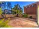 Backyard featuring desert landscaping, a stamped concrete patio, and a block wall at 11178 Corsica Mist Ave, Las Vegas, NV 89135