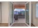 View of a balcony from inside, featuring a chair and neighborhood view at 11178 Corsica Mist Ave, Las Vegas, NV 89135