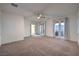 A light-filled bedroom with balcony access and a ceiling fan at 11178 Corsica Mist Ave, Las Vegas, NV 89135