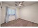 Bedroom with a window and blue curtains at 11178 Corsica Mist Ave, Las Vegas, NV 89135