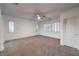 Spacious bedroom featuring neutral carpet, ceiling fan, and bright natural light at 11178 Corsica Mist Ave, Las Vegas, NV 89135