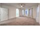 Bedroom with ceiling fan and neutral carpet and paint at 11178 Corsica Mist Ave, Las Vegas, NV 89135