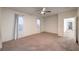 Bedroom with neutral carpet and walls and an ensuite bathroom at 11178 Corsica Mist Ave, Las Vegas, NV 89135