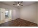 Bedroom with wood floors, closet and bathroom entrances, and ample natural light at 11178 Corsica Mist Ave, Las Vegas, NV 89135