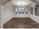 An open dining room with hardwood flooring, arched doorways, and white walls at 11178 Corsica Mist Ave, Las Vegas, NV 89135