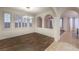 Dining area with wood floors, modern lighting fixture, and bright windows at 11178 Corsica Mist Ave, Las Vegas, NV 89135