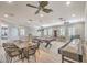 A well-lit game room offering a ping pong table, bar seating, a shuffleboard table, and additional lounge seating at 11178 Corsica Mist Ave, Las Vegas, NV 89135