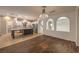 An open kitchen with island, stainless steel appliances, hardwood and tile floors at 11178 Corsica Mist Ave, Las Vegas, NV 89135