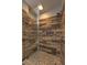 Walk-in shower featuring wood-look tiles, a built-in bench, and modern fixtures at 11178 Corsica Mist Ave, Las Vegas, NV 89135