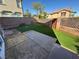 Low-maintenance backyard featuring artificial turf, a patio, and a privacy fence at 1155 Paradise Safari Dr, Henderson, NV 89002