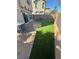 Backyard featuring artificial turf, a patio, and siding glass door access to the home at 1155 Paradise Safari Dr, Henderson, NV 89002
