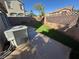 Backyard with patio, artificial turf, and privacy fence at 1155 Paradise Safari Dr, Henderson, NV 89002