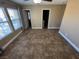 Bedroom featuring neutral walls, tile flooring, large windows, and a ceiling fan at 1155 Paradise Safari Dr, Henderson, NV 89002