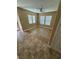 Bedroom featuring neutral walls, tile flooring, and large windows at 1155 Paradise Safari Dr, Henderson, NV 89002