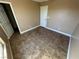 Tiled bedroom with neutral walls, white trim, and a view of the closet at 1155 Paradise Safari Dr, Henderson, NV 89002