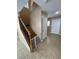 Bright foyer with tile floor, staircase, and white entry door at 1155 Paradise Safari Dr, Henderson, NV 89002