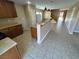 Spacious kitchen with granite countertops, kitchen island, and stairs leading up at 1155 Paradise Safari Dr, Henderson, NV 89002