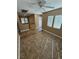 Living room featuring neutral walls, tile flooring, and large windows at 1155 Paradise Safari Dr, Henderson, NV 89002