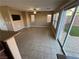 Living room featuring a sliding glass door, tiled floor, and neutral walls at 1155 Paradise Safari Dr, Henderson, NV 89002