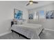 Comfortable bedroom with a queen-sized bed, neutral decor, carpet flooring, and natural light from the window at 11732 Del Sur Ave, Las Vegas, NV 89138