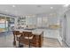 Modern kitchen featuring custom cabinetry, a center island, and stainless steel appliances at 11732 Del Sur Ave, Las Vegas, NV 89138