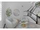 Bright living room featuring a staircase, modern decor, and neutral color palette at 11732 Del Sur Ave, Las Vegas, NV 89138