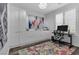 Modern home office features built in storage, a modern work space, light colored walls and hardwood floors at 11732 Del Sur Ave, Las Vegas, NV 89138