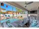 Cozy covered patio featuring a built-in grill, outdoor seating, and view of the pool at 11732 Del Sur Ave, Las Vegas, NV 89138